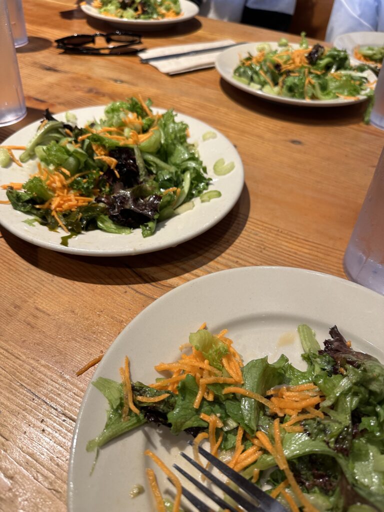 plates of salad from Flatbread Company in Portland Maine