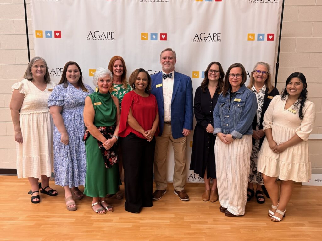 The Agape of Central Alabama team together at a Raising Hope benefit dinner.